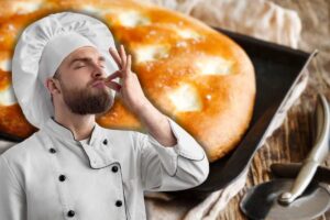 focaccia nella teglia del forno e chef bacio